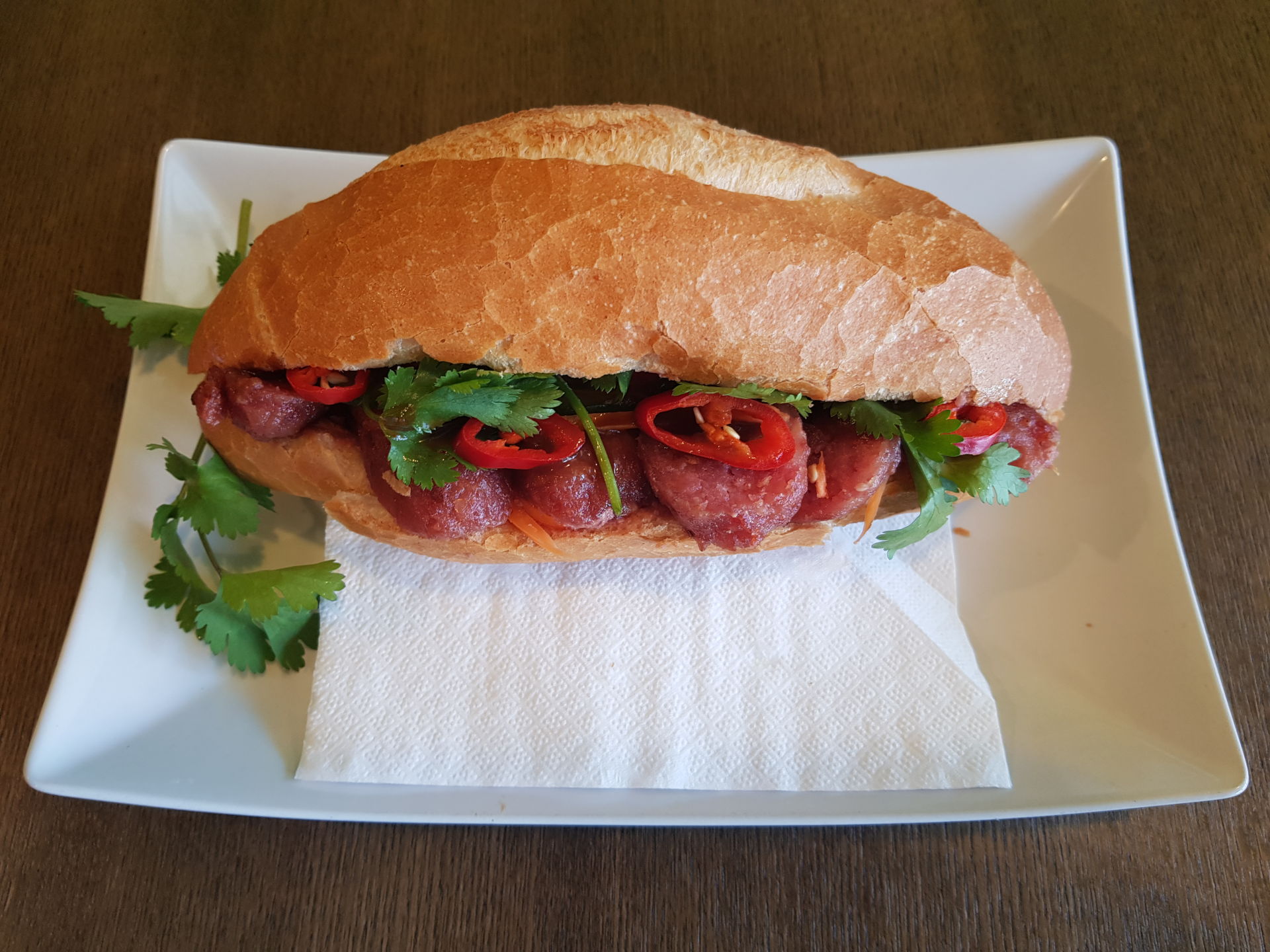 Bread roll with BBQ Vietnamese Pork Sausage Bánh Mì Nem Nướng Canh